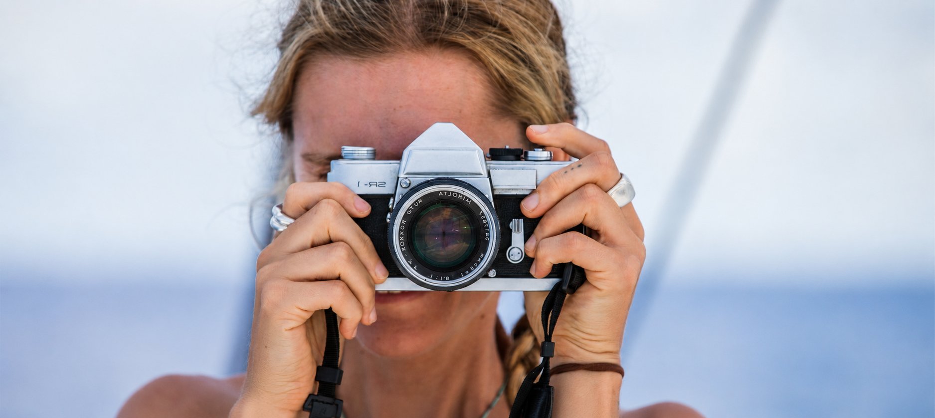 A volunteer photographing wildlife from a boat during the Great Southern BioBlitz
